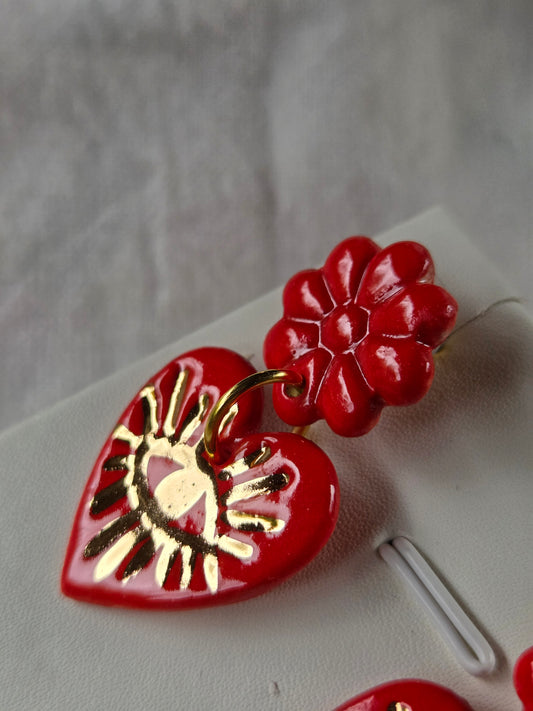 Corazón de los rayos rojo y oro 2