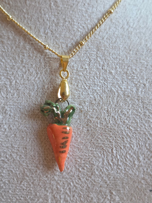Dije de zanahoria con oro