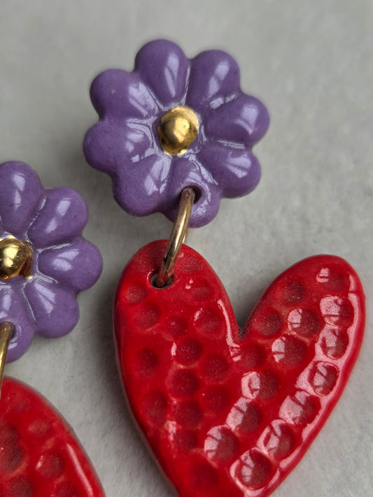 Aros corazón rojo y morado 2 piezas con oro