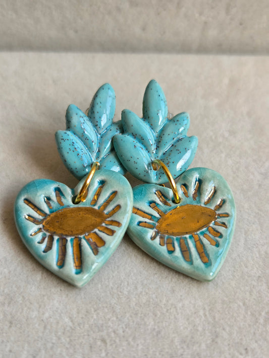 Aros cuore ojos turquesa con oro
