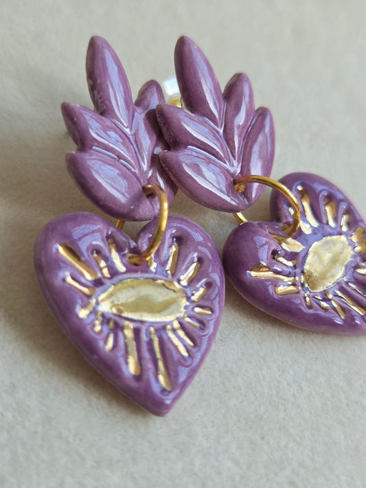 Aros cuore ojos morado con oro
