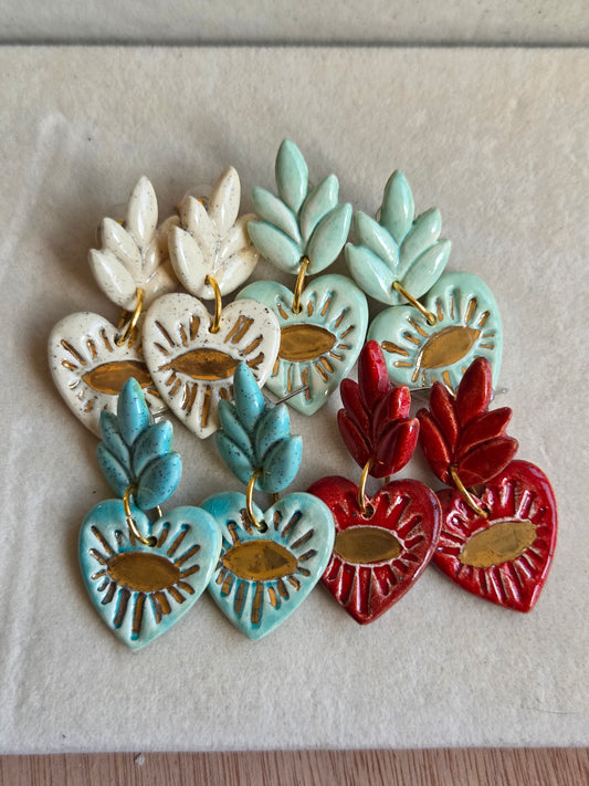 Aros cuore ojos turquesa con oro