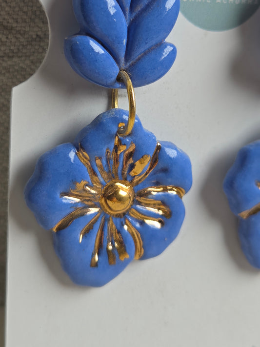 Aros 2 piezas espiga y flor azulino botella con oro