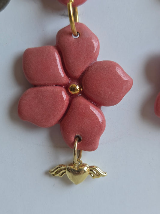 Aros 2 piezas rosado/ oro + corazón alado