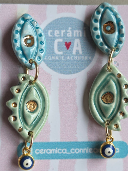 Aros 2 piezas ojos en celeste turquesa- julio