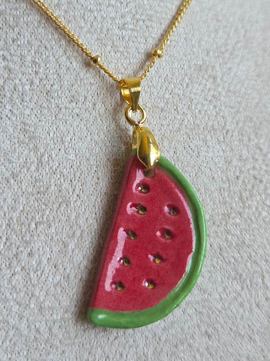 Dije de sandía con oro