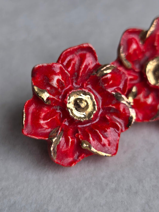 Aros flor roja con oro 1 pieza