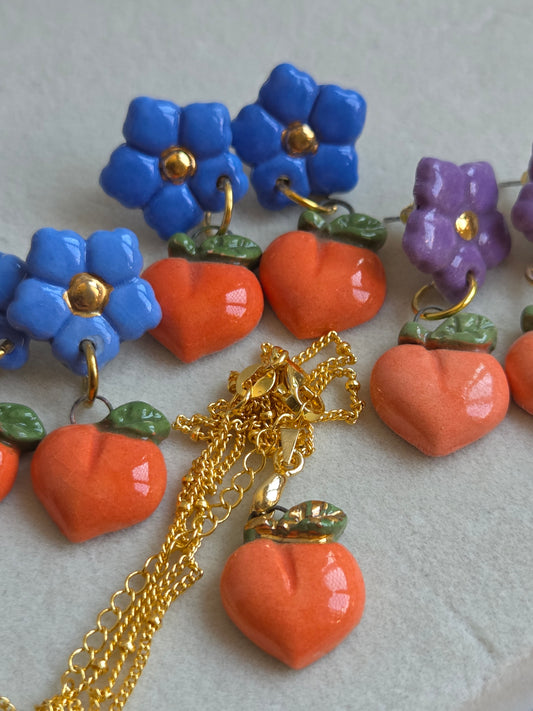 Aros 2 piezas duraznos con oro