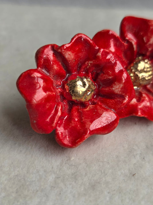 Aros flor roja 2 con oro 1 pieza