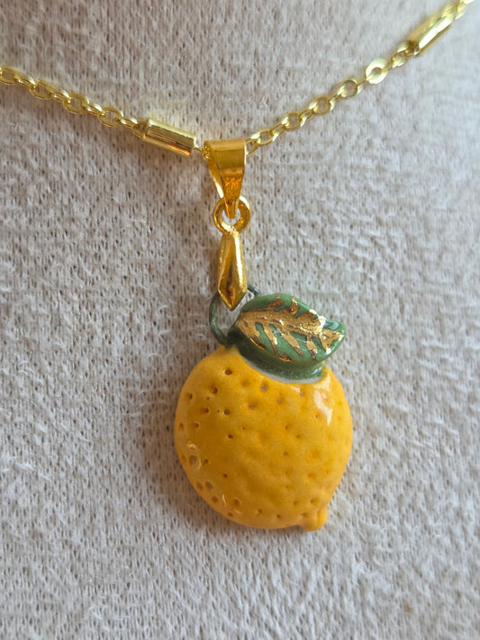 Dije de limón con oro