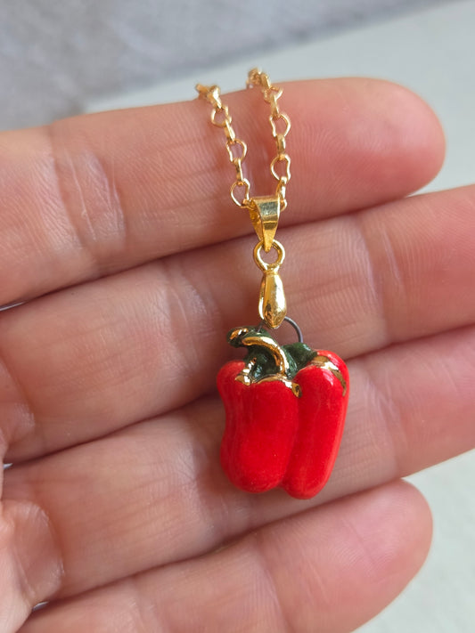 Dije de pimentón con oro