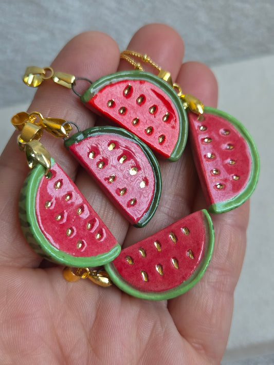 Dije de sandía con oro